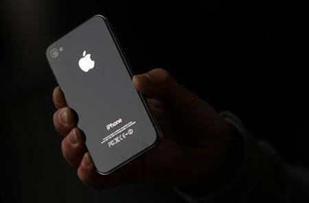 Luke Peters holds the new iPhone 4S outside the Apple store in Covent Garden, London Luke Peters holds the new iPhone 4S outside the Apple store in Covent Garden, London