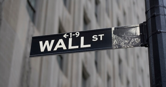 Wall Street Sign and Gray Building