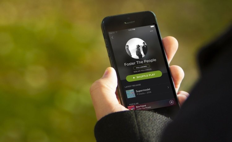 Apple Music никак не может «достать» Spotify. Фото.