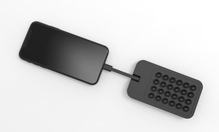 Внешний аккумулятор для iPhone. Аккумулятор можно закрепить на заднике iPhone, а можно оставить просто так. Фото.