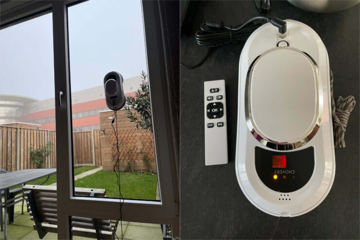 Робот для мытья окон. Мойщик окон умудряется держаться на стёклах и не падать. Но страховка ему всё равно нужна. Фото.