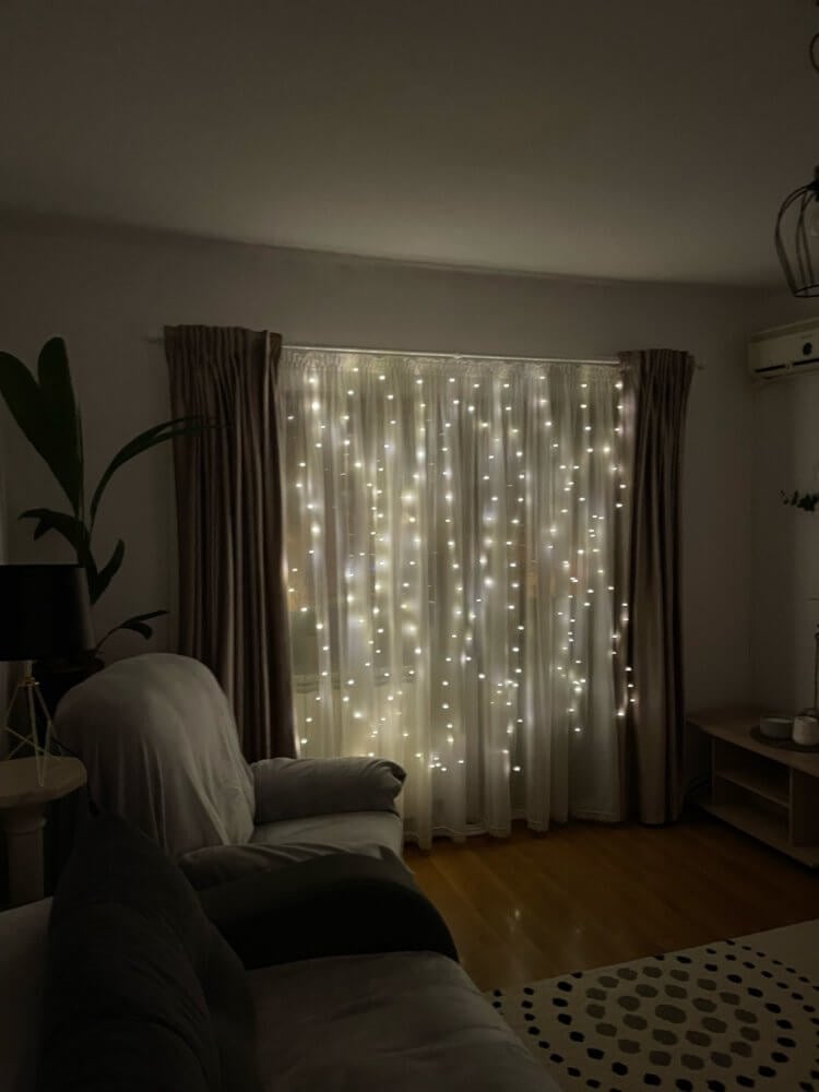 LED garland curtain.  If you do not plan to put up Christmas trees, then be sure to hang such a curtain, and the New Year's mood will immediately set in.  A photo.