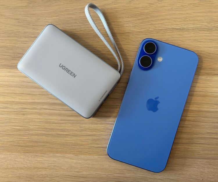 Внешний аккумулятор с беспроводной зарядкой. Провод можно использовать в качестве ремешка. Фото.