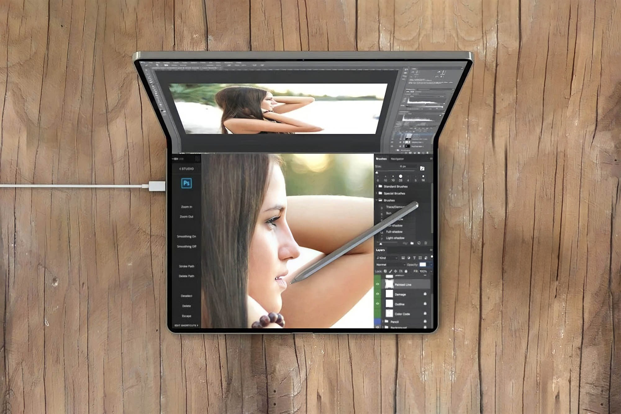 Складной MacBook, который был приоритетом Тернуса, отменили. Рендер складного MacBook. Фото.