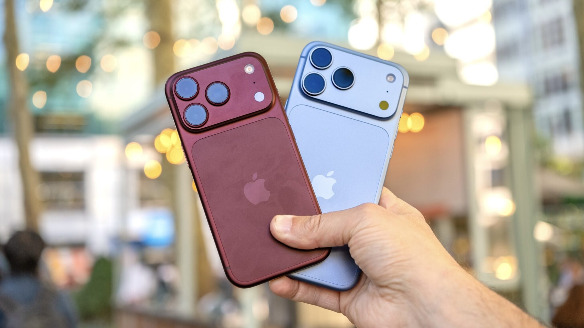 iPhone 18 Pro и iPhone 18 Pro Max на фоне города