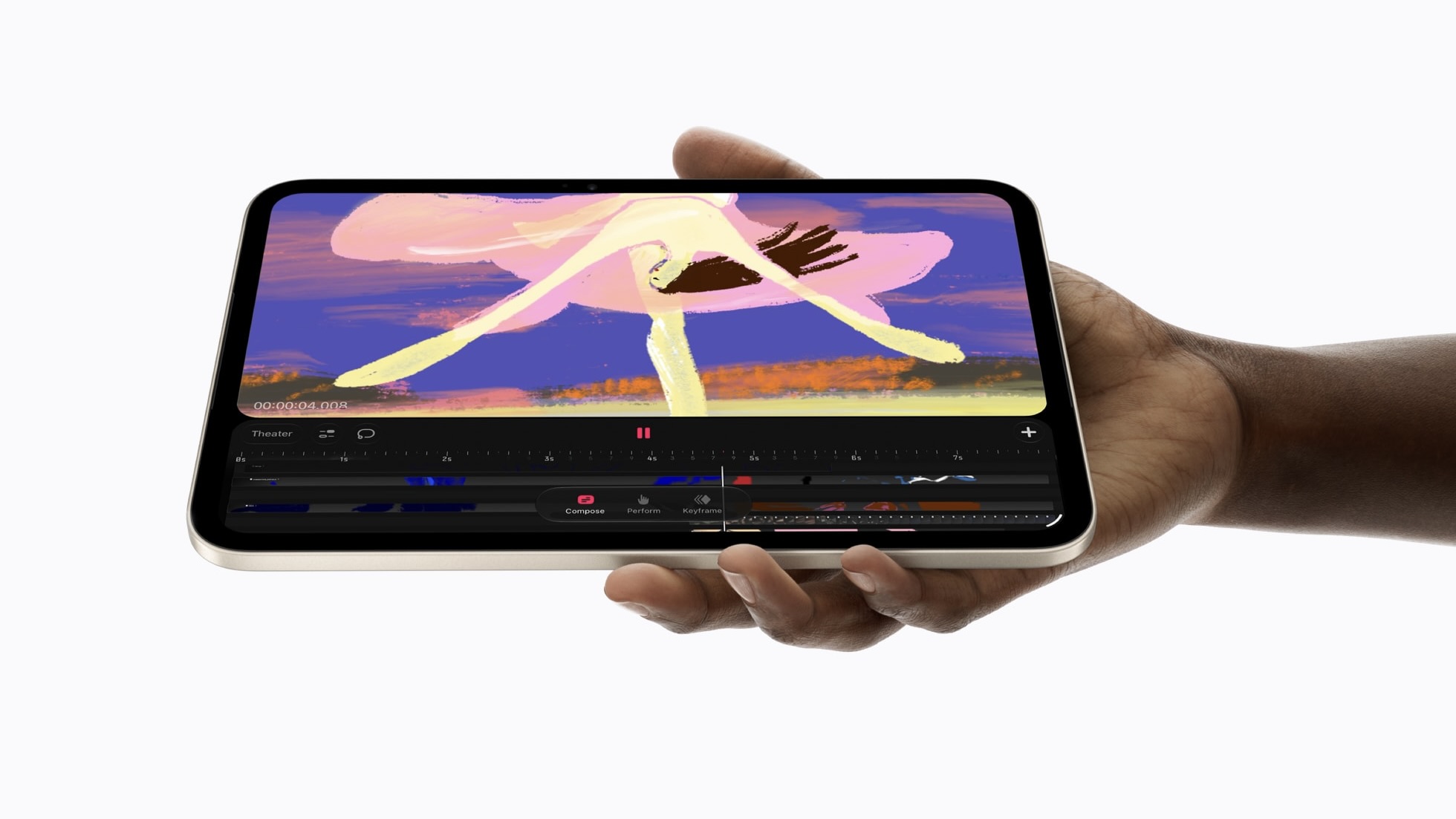 Рука держит iPad mini горизонтально, на экране открыт редактор анимации с рисунком танцовщицы